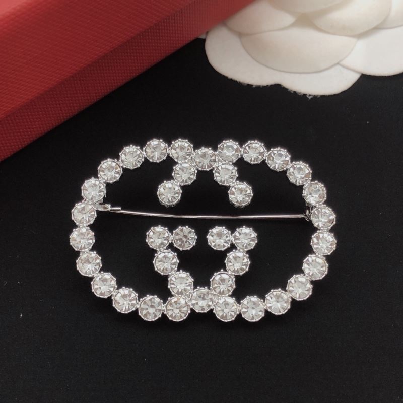Gvc*1 brooches